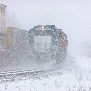 EMDX 826 disappears into the heavy blizzard at Lockport!