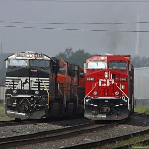 CP #8842 passes NS #7643 coal train Elkhart depot