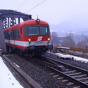 Intercity train on old steel bridge