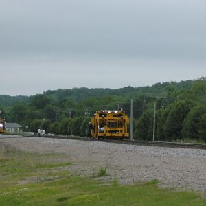 Three MOW vehicles in file, westbound