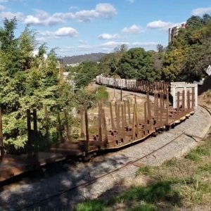 Empty logging train in the S curve
