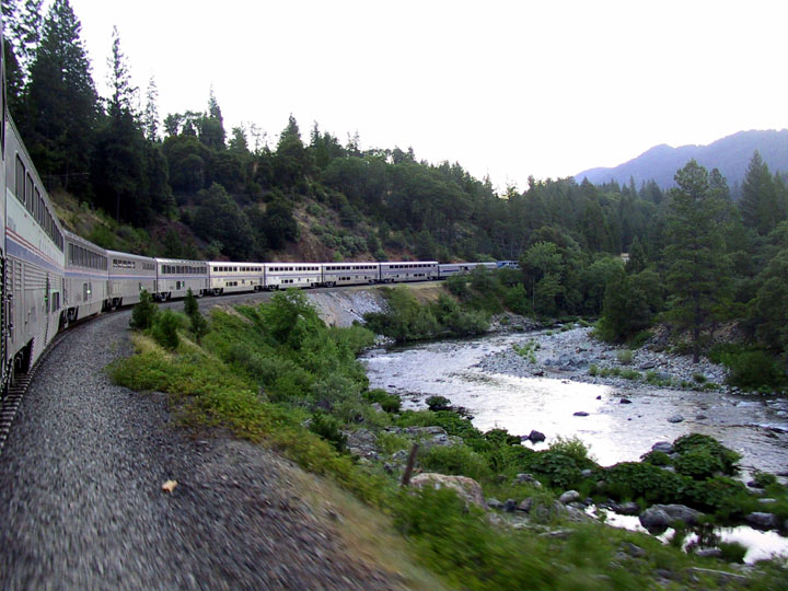 Coast Starlight rounding a river curve in Northern California