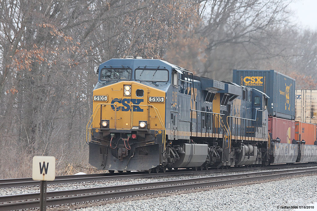 CSX 5105 stack train heads east Co Rd. 150 Portage IN.