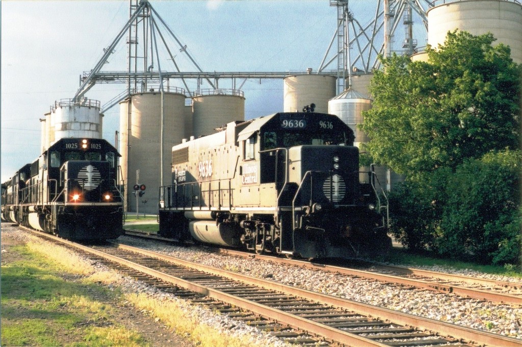 IC 96 waits for a loaded grain train to clear