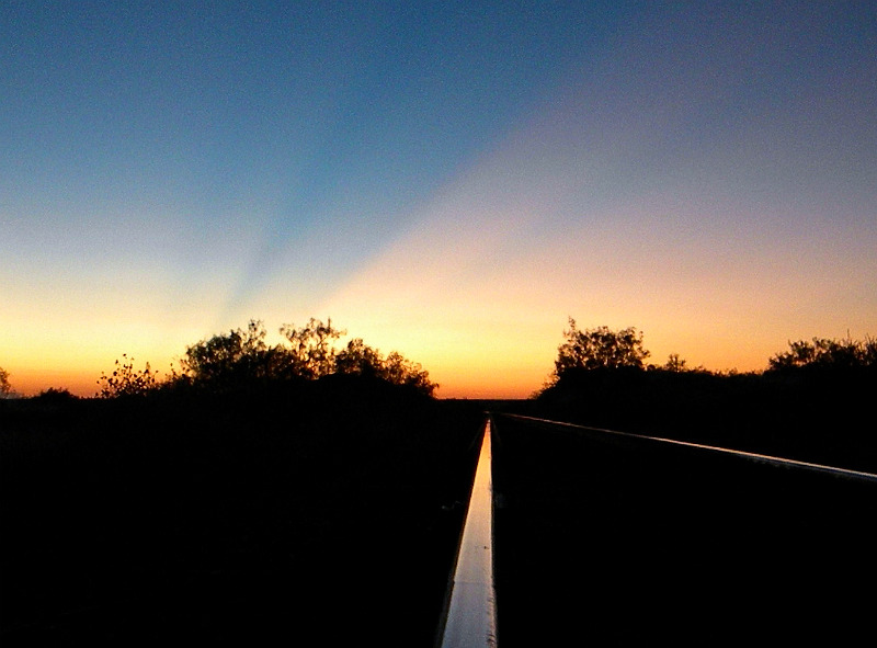 Sun setting on the rails