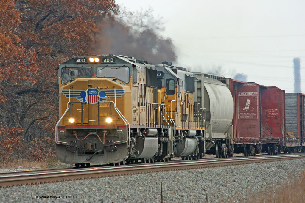 UP #4010 SD70M mixed freight heading west Ogden Dunes, IN