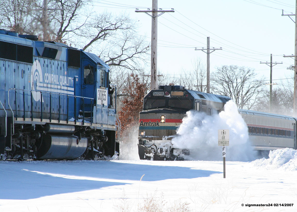 B-1-G  works in Dowagaic, MI as Amtrak 350 rolls by.