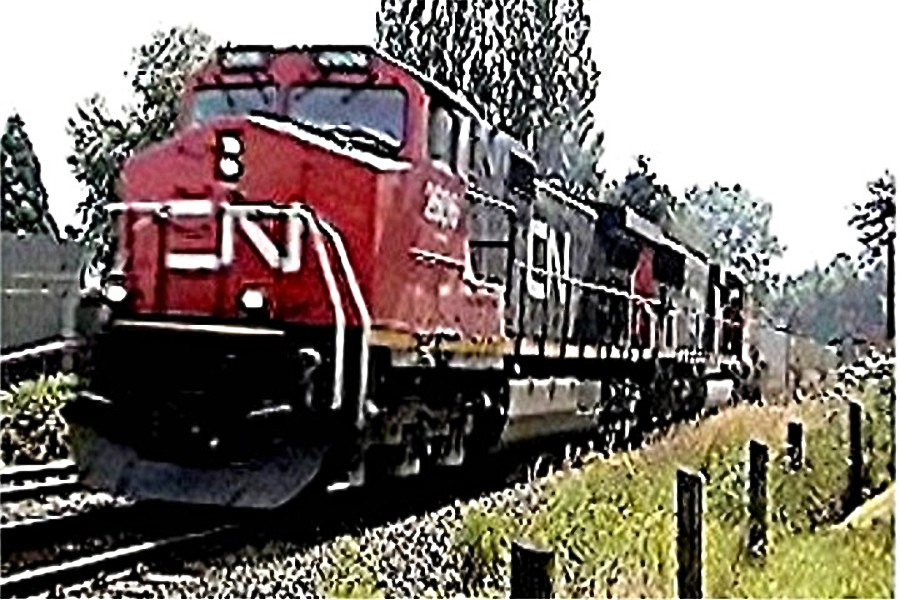 C N 2606 and 5744 at speed westbound at Fort Langley on a container train