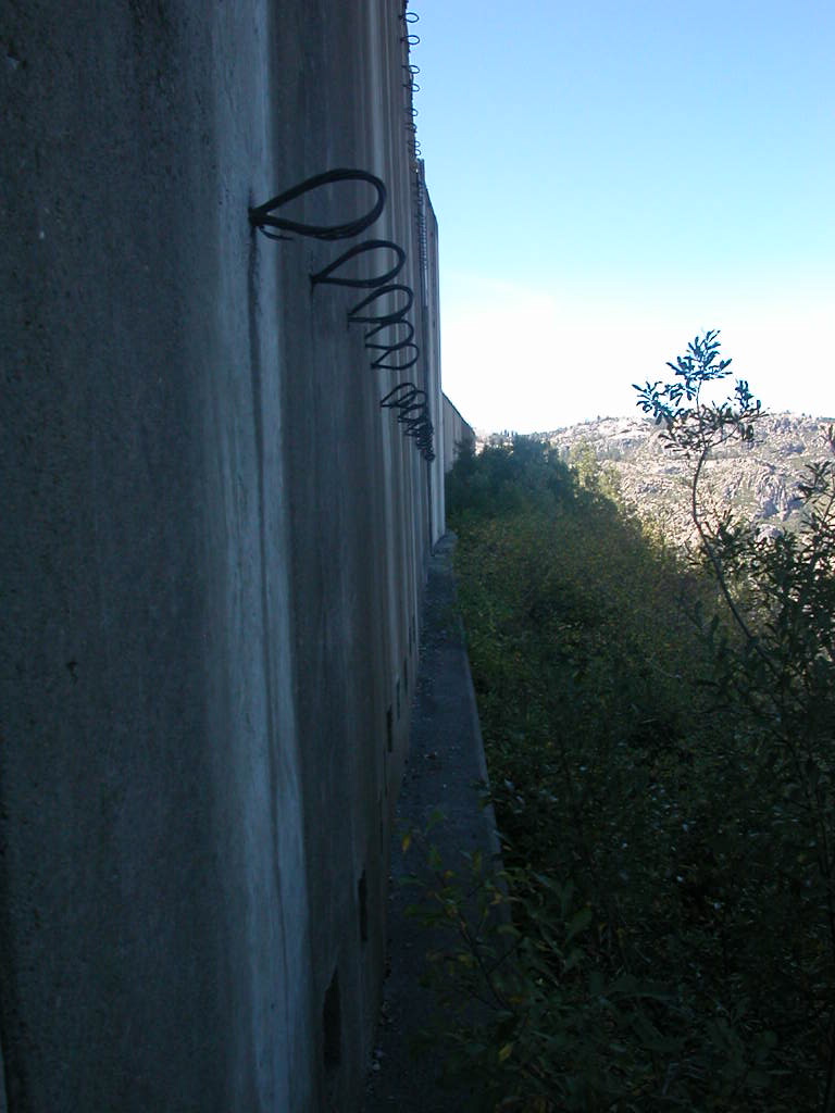 cable guides on the outer wall of a snow shed