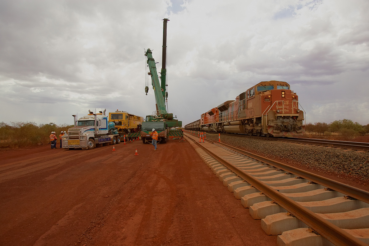 Two SD70ACe's, two cranes, one tamper and a Mack
